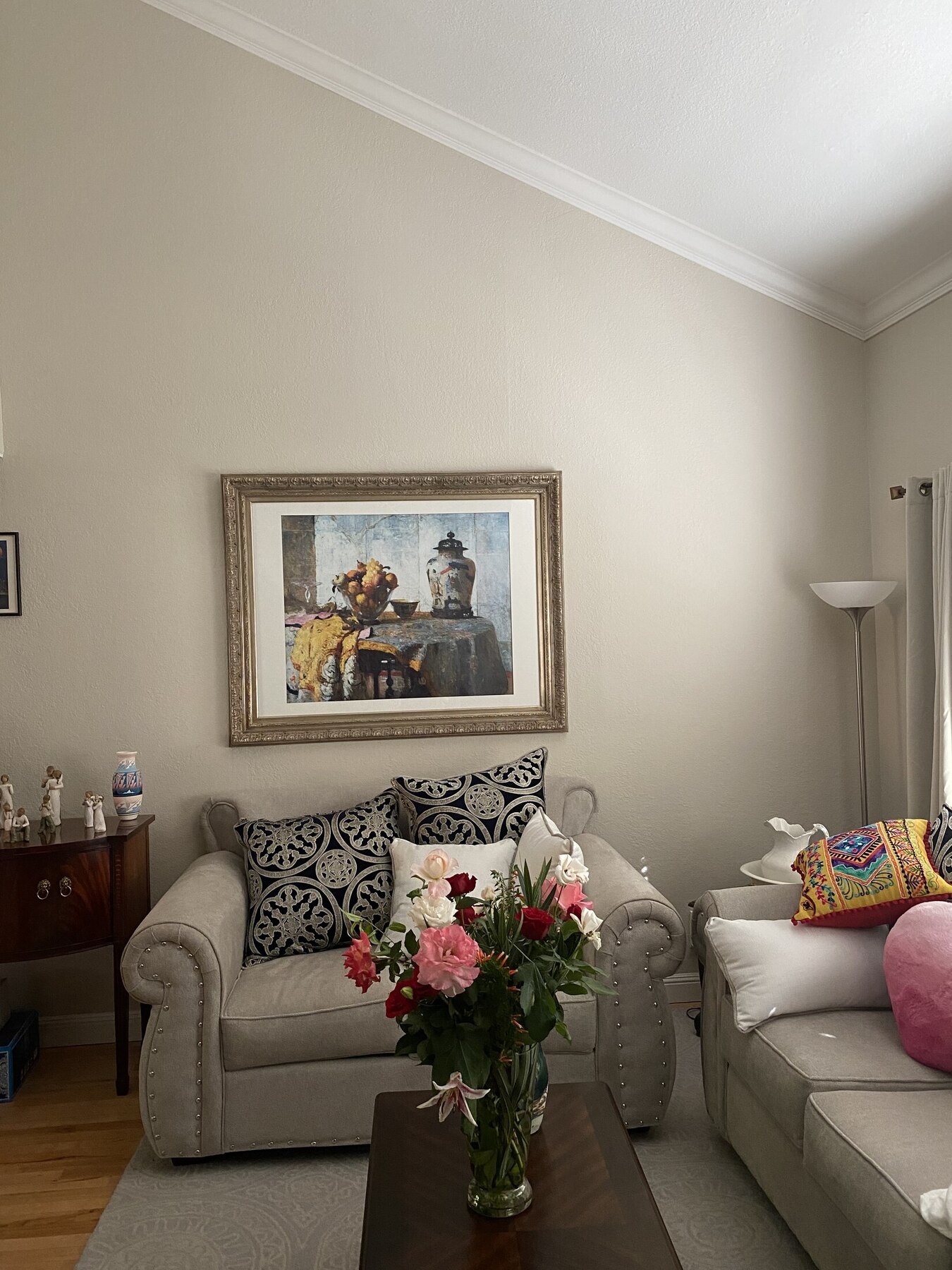 A finished living room with warm, neutral wall color