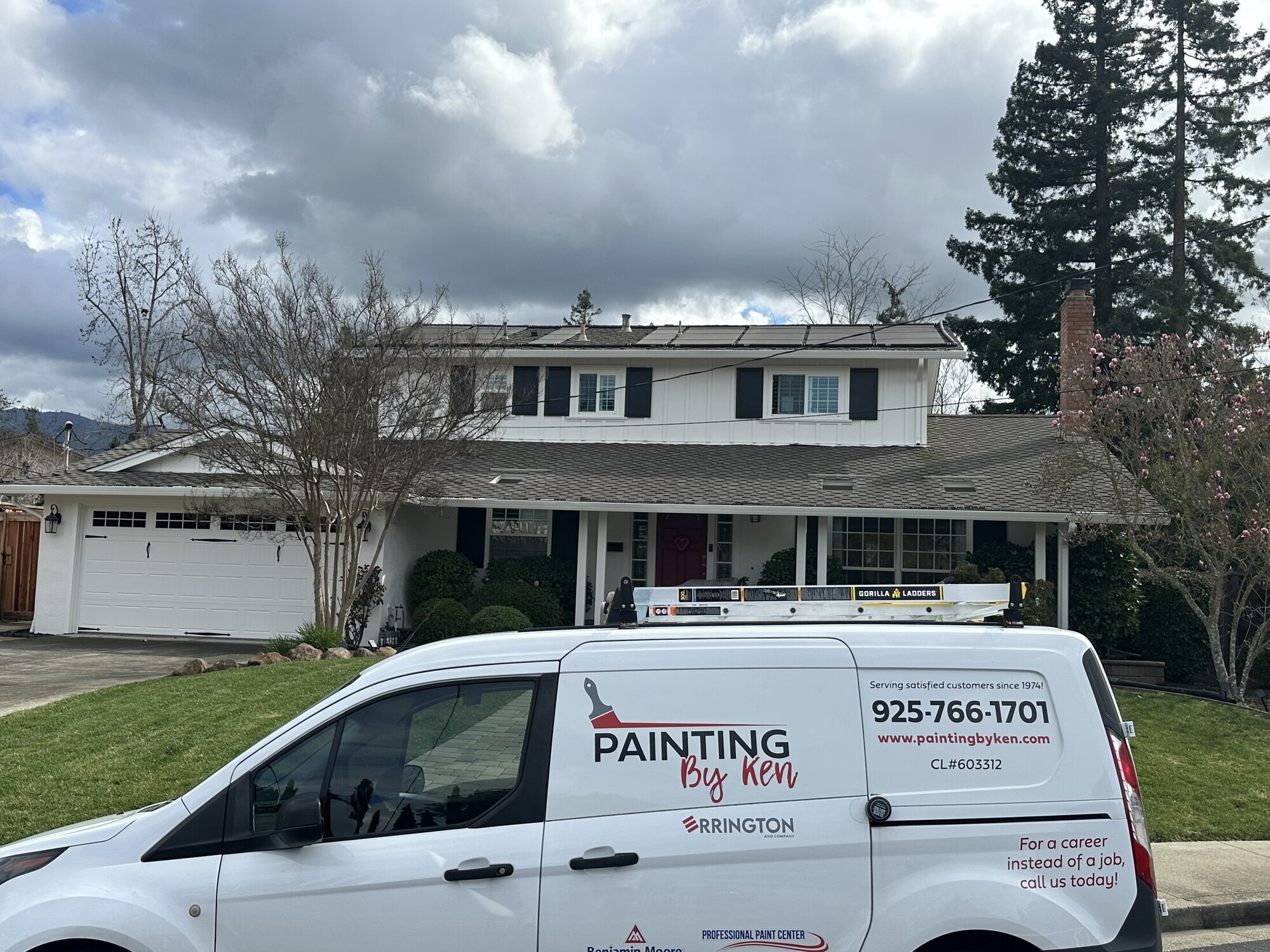 Homeowner and painting contractor discussing a completed project